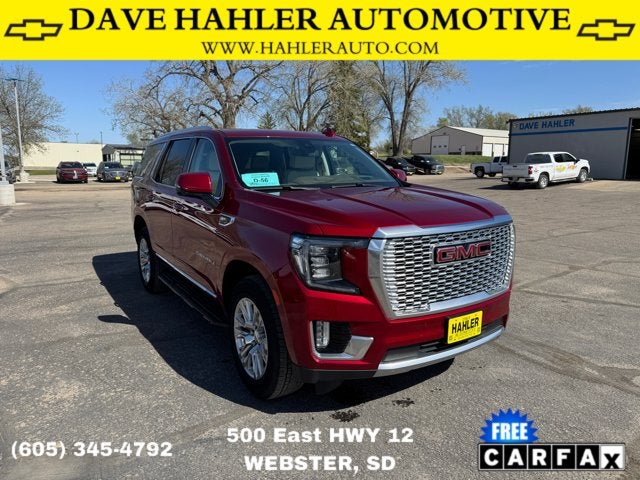 2022 GMC Yukon Denali in Maroon — front three-quarter view